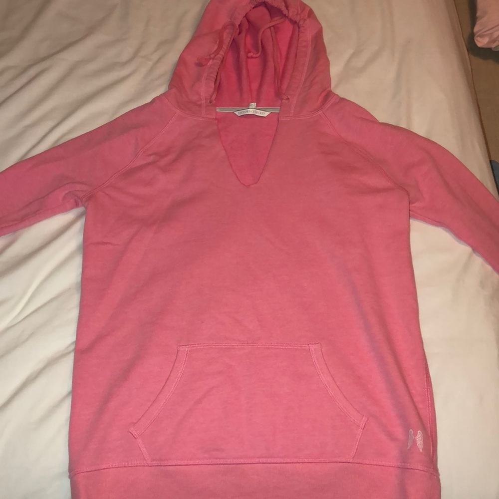 pink colored sweatshirt with white writing on back